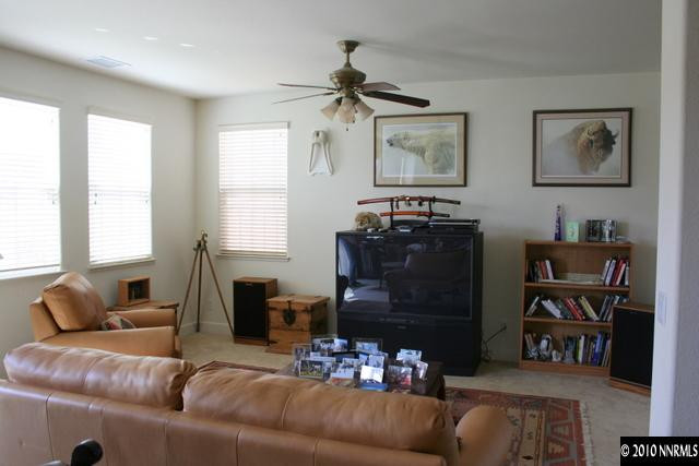 410 Stradella Court Reno, NV 89521 - Photo 4 of 9 a living room with furniture and a fireplace