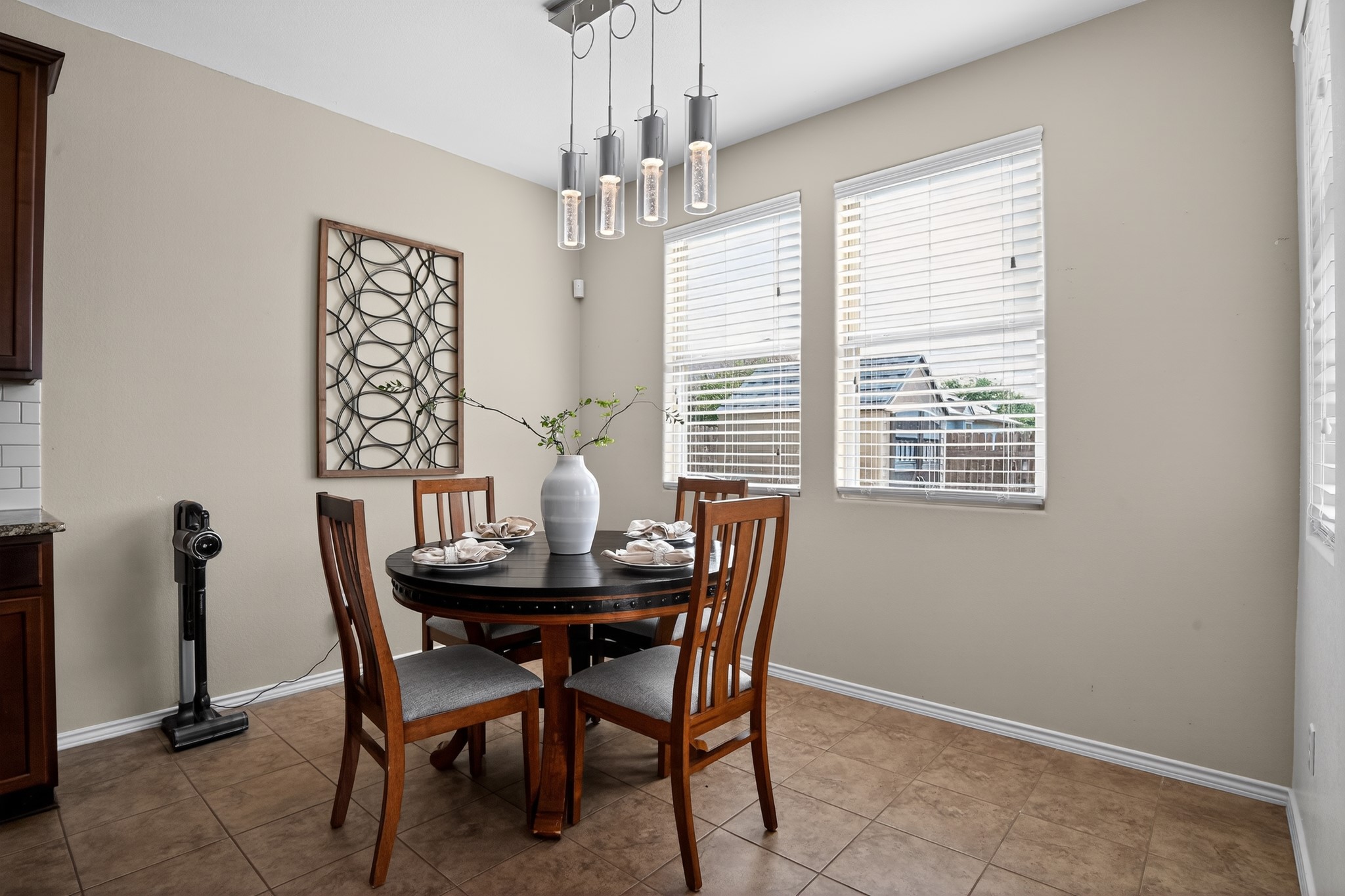 16816 Ruggio Road Pflugerville, TX 78660 - Photo 8 of 30 A charming dining area features tiled floors and abundant natural light.