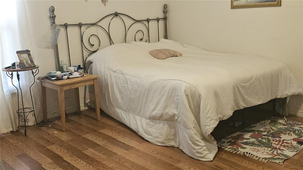 871 Reflections Loop East Winter Haven, FL 33884 - Photo 4 of 9 a bedroom with a bed and a mirror