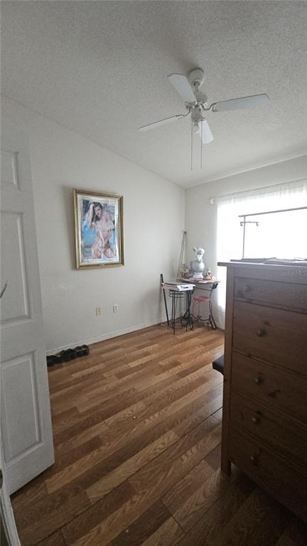 871 Reflections Loop East Winter Haven, FL 33884 - Photo 5 of 9 a room with a bed and a chandelier