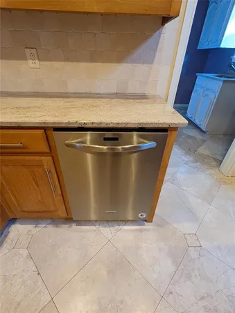 a utility room with a sink a vanity and a window