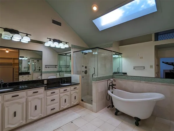 a bathroom with a bathtub and a shower