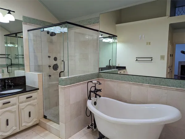 a bathroom with a shower and a sink