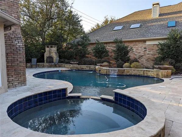 swimming pool view with a seating space