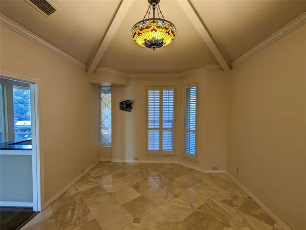 a view of an entryway with a chandelier