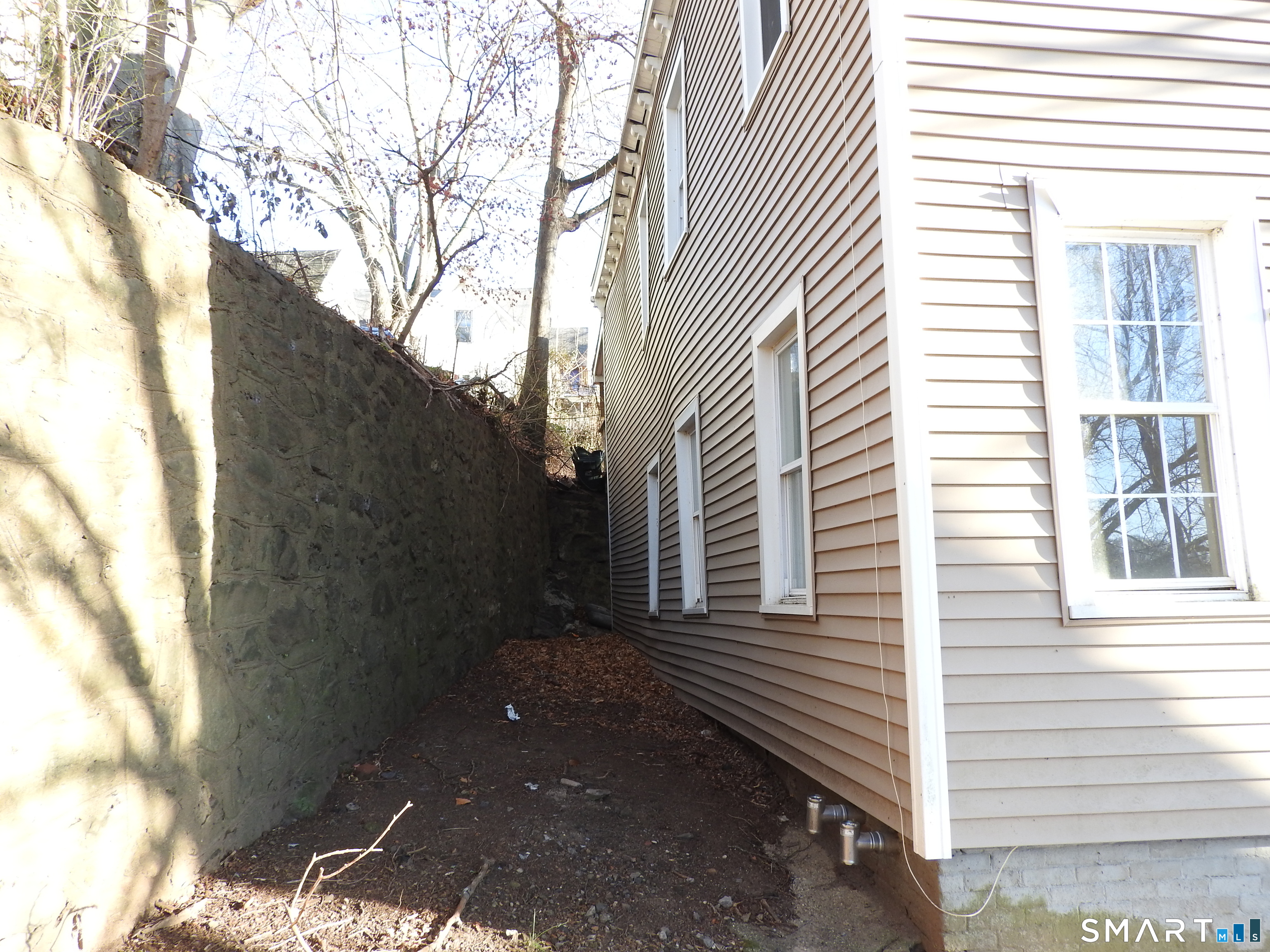 11 Division Street Norwich, CT 06360 - Photo 5 of 10 a view of a house with a yard