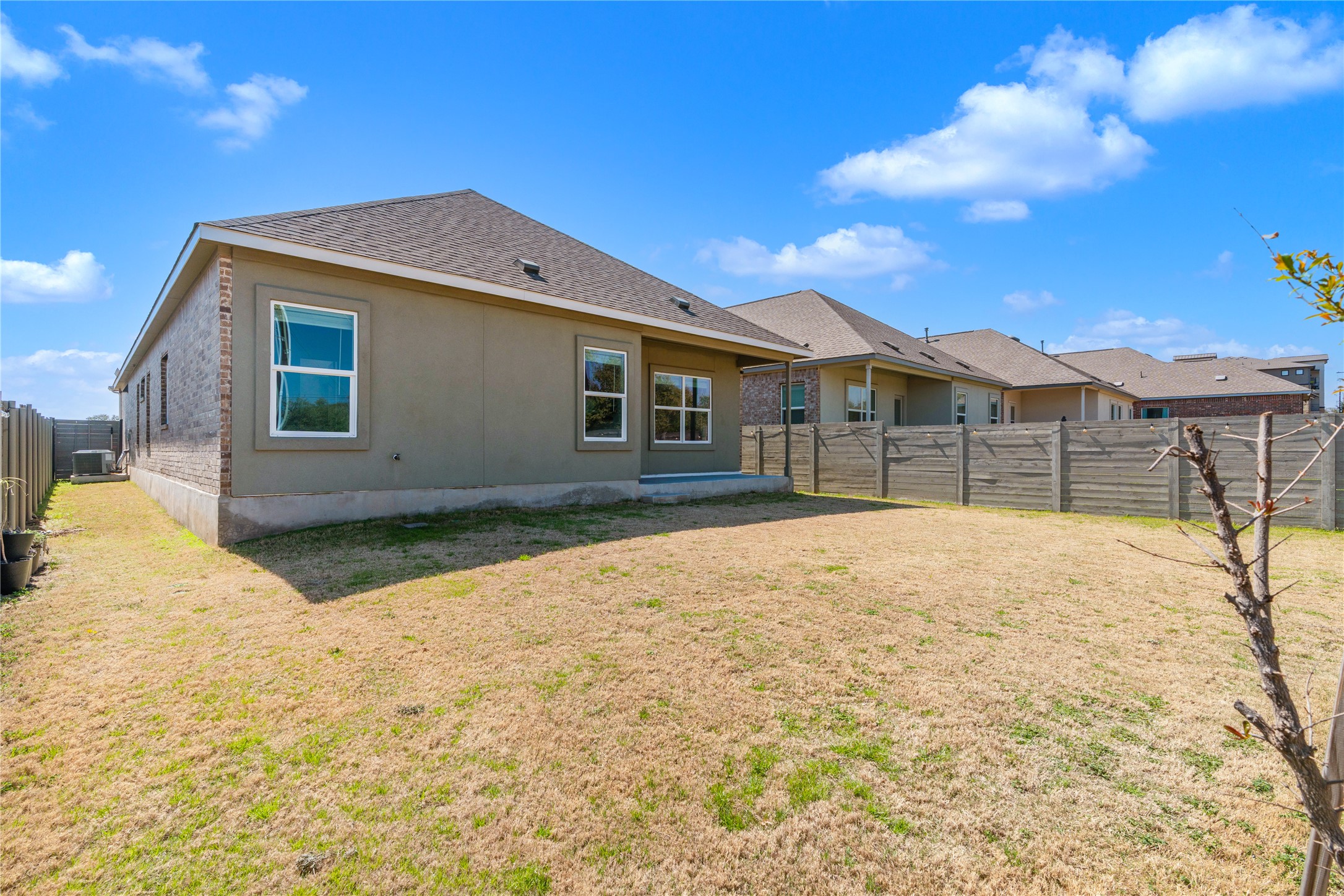 212 Saddle Mountain Road Georgetown, TX 78628 - Photo 27 of 30 A spacious backyard awaits, ready for your personal touch and outdoor enjoyment.