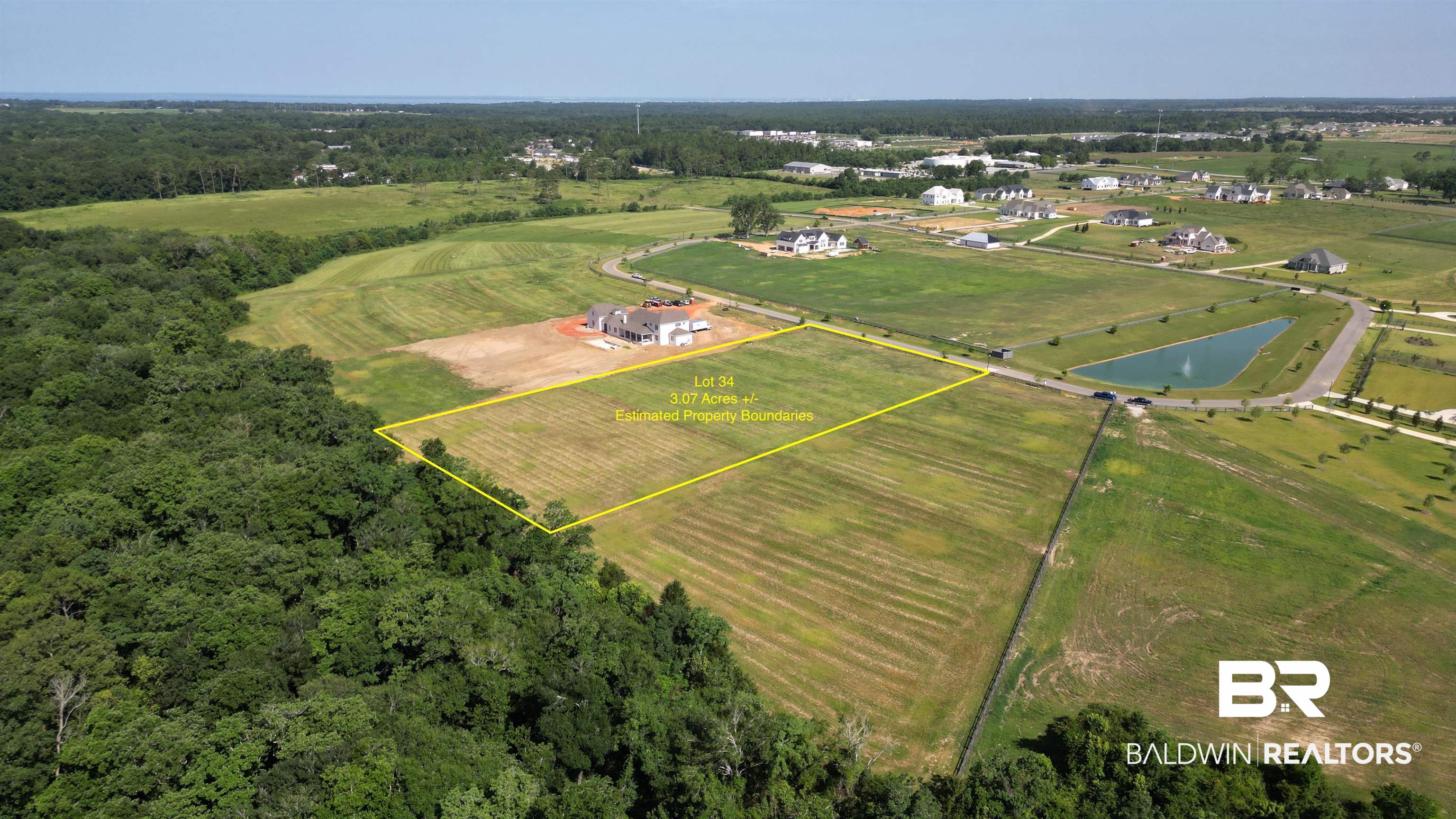 0 Gallery Boulevard Fairhope, AL 36532 - Photo 1 of 13 Aerial view of sparsely populated area with property boundaries highlighted and a large body of water