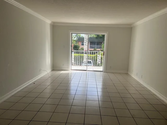 a view of an empty room and window