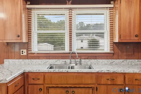 a kitchen with a refrigerator sink and stove