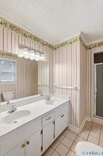 a bathroom with a shower and a sink