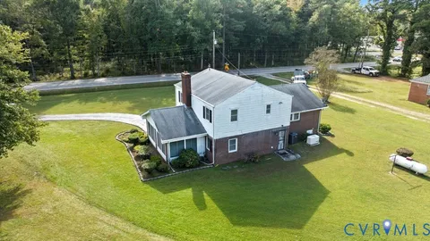 a bathroom with a sink mirror and a window