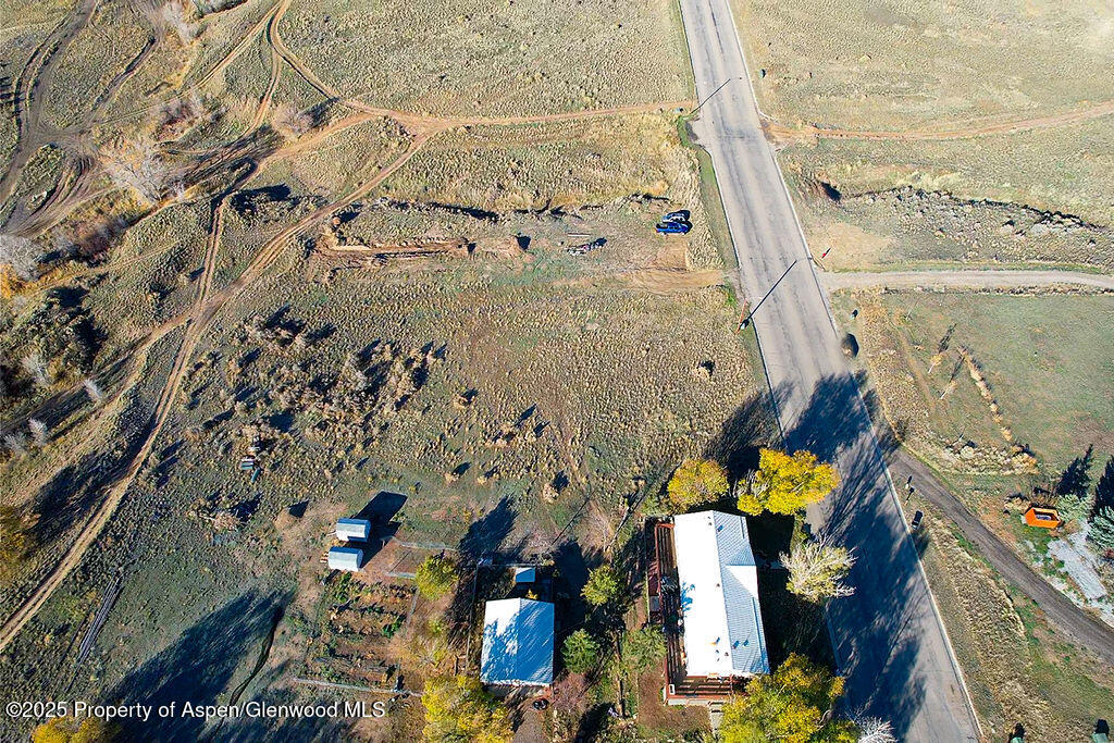 Tbd East 7th Street Craig, CO 81625 - Photo 5 of 9 an aerial view of a house with a yard