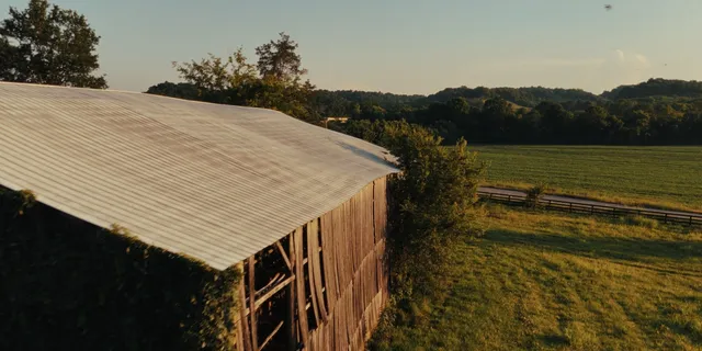 an aerial view of a house with a lake view