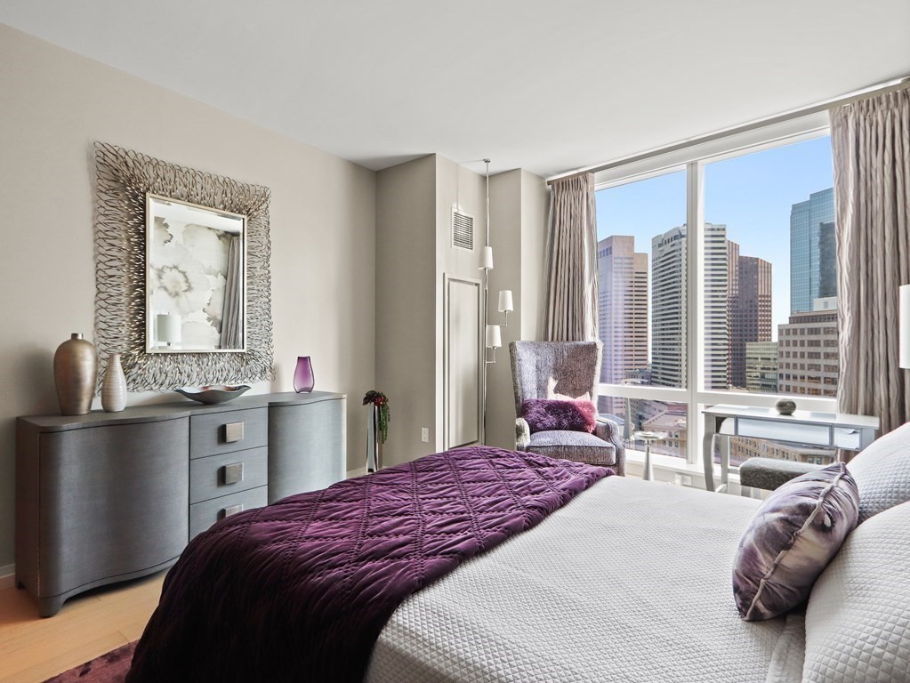 1 Franklin Street, Unit 2307 Boston, MA 02110 - Photo 16 of 28 a bedroom with a bed and large windows