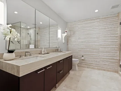 a bathroom with a double vanity sink mirror and double