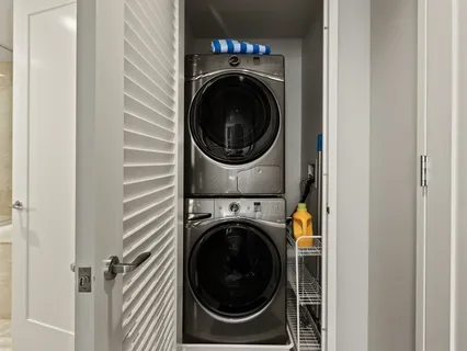 a view of a hallway with washer and dryer