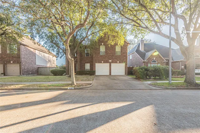 a house with trees in the background