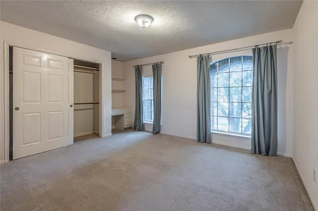 a view of empty room with windows