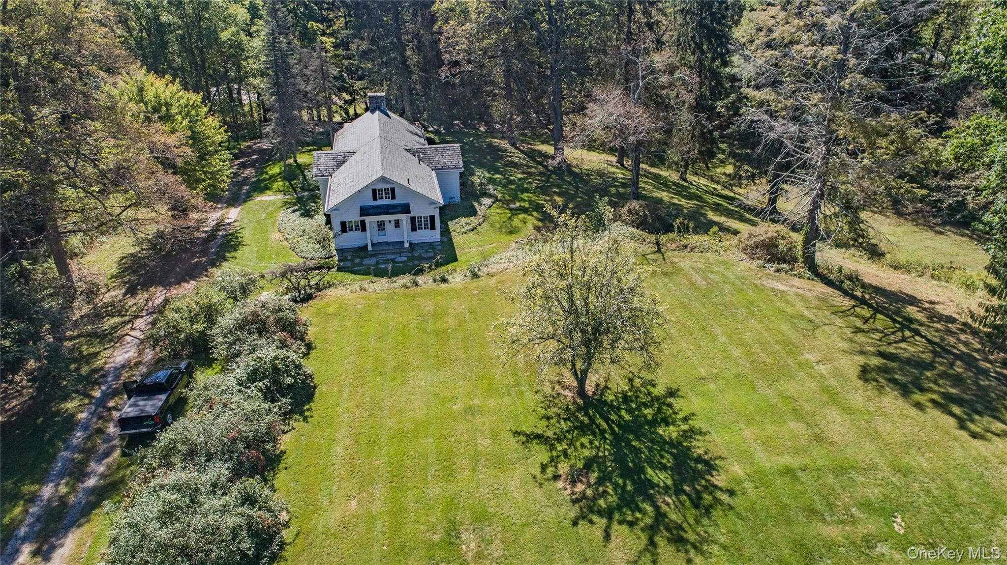 21-23 Tinker Town Road Dover Plains, NY 12522 - Photo 23 of 26 Yard surrounding the ranch styled home.