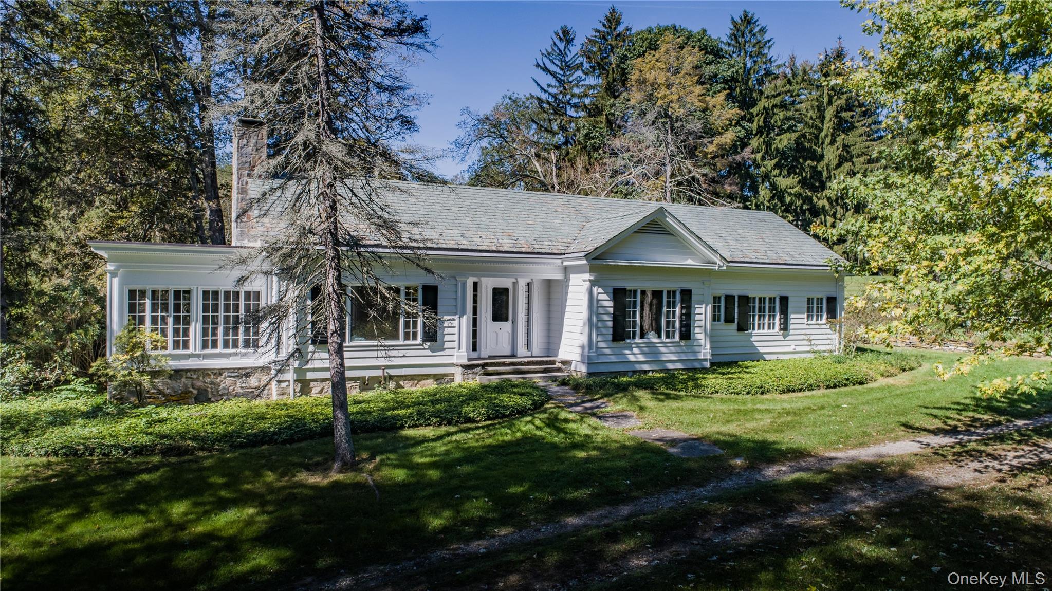 21-23 Tinker Town Road Dover Plains, NY 12522 - Photo 5 of 26 A 2,272 SF ranch-style home featuring 2 bedrooms, 1½ baths, generously sized rooms with high ceilings, and an enclosed porch.
