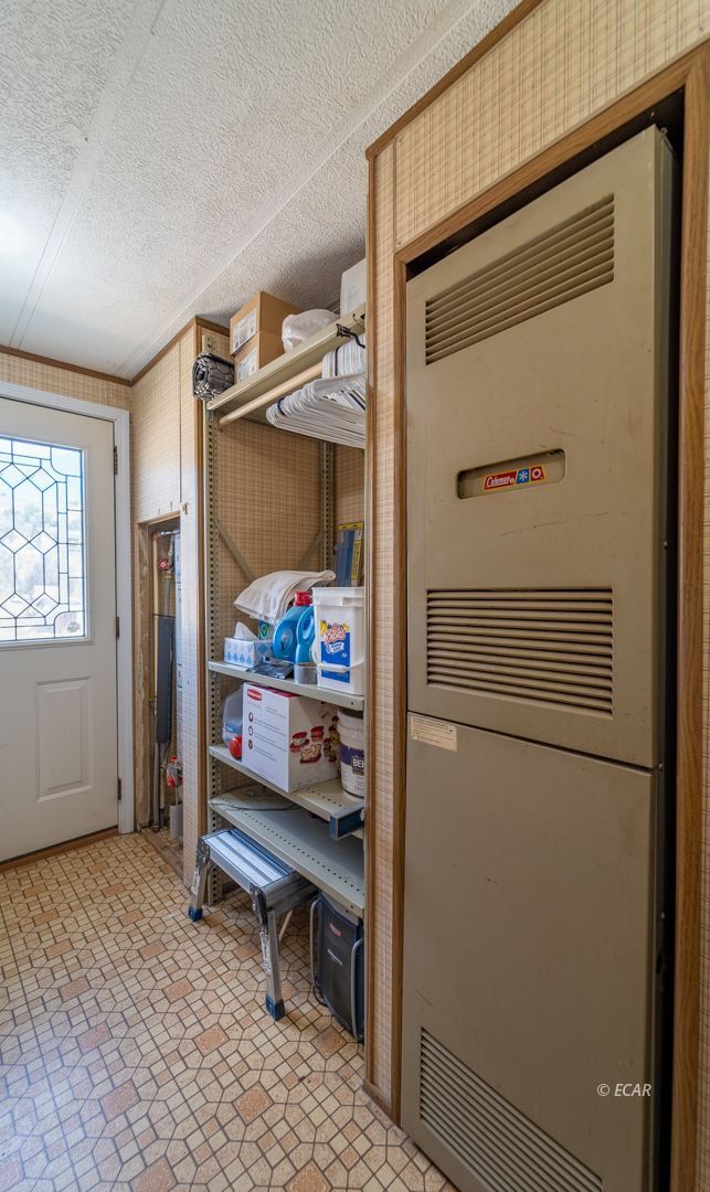 659 Spring Valley Lane Spring Creek, NV 89815 - Photo 10 of 25 a room with storage and utility