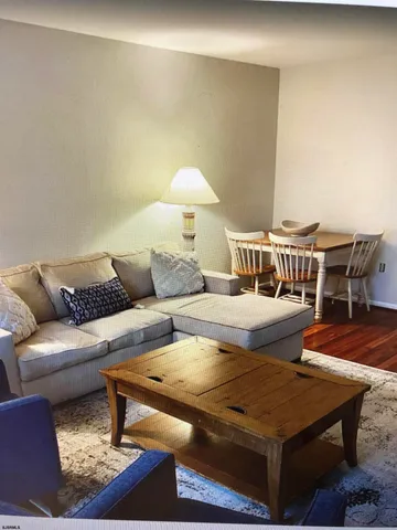 a living room with furniture and a table