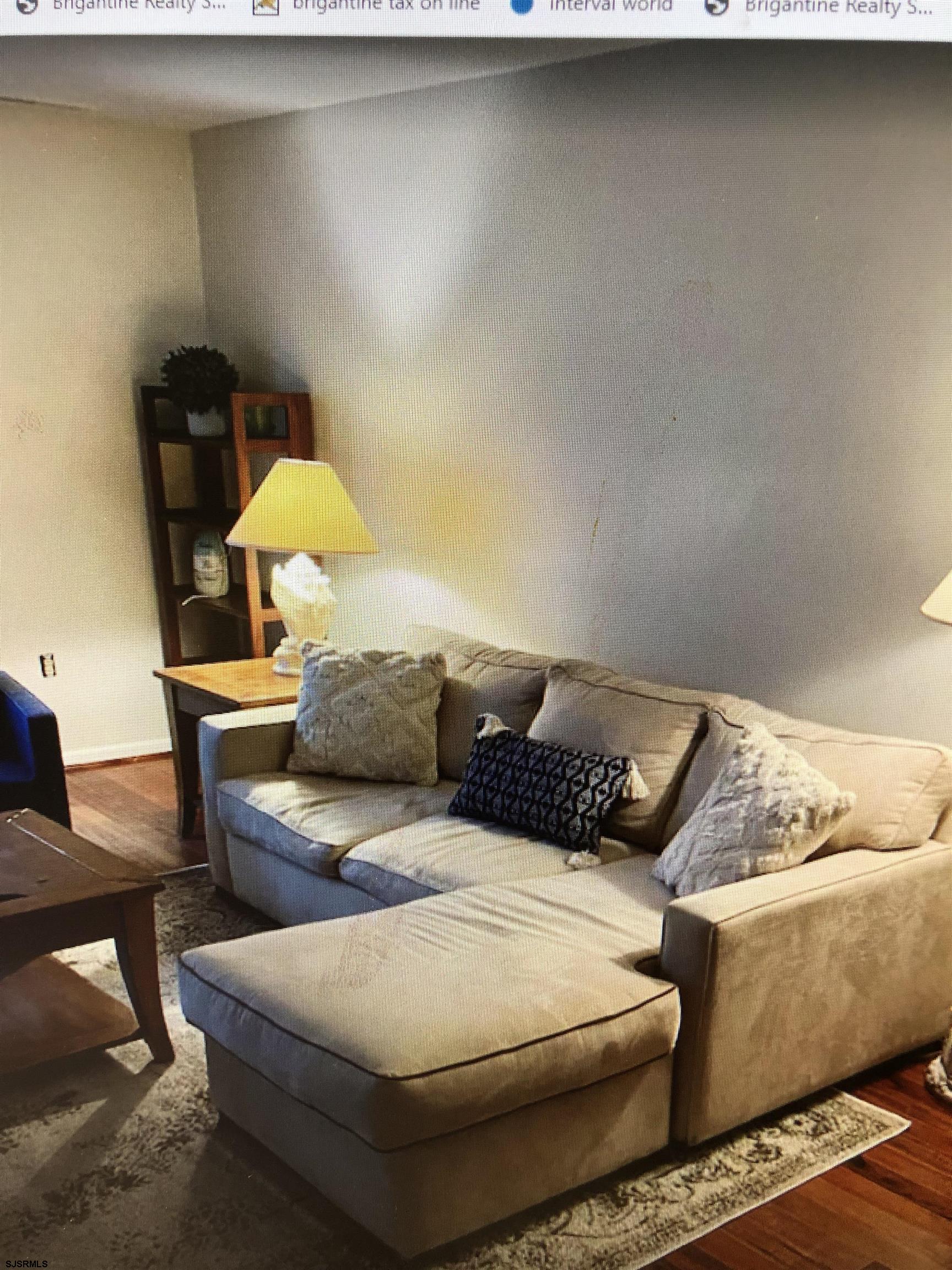 217 3rd Street South, Unit A Brigantine, NJ 08203 - Photo 5 of 10 a living room with furniture