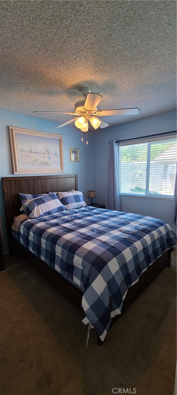 7153 Walcott Place Rancho Cucamonga, CA 91739 - Photo 13 of 35 a bedroom with a bed lamp and window