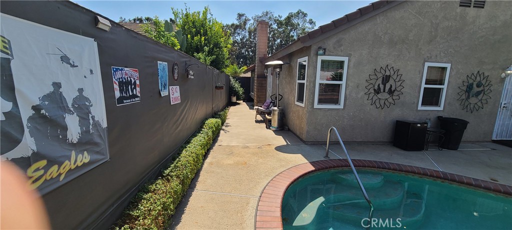 7153 Walcott Place Rancho Cucamonga, CA 91739 - Photo 24 of 35 a swimming pool with outdoor seating and plants