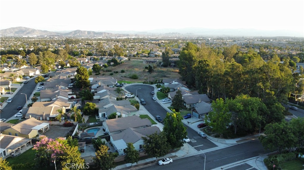 7153 Walcott Place Rancho Cucamonga, CA 91739 - Photo 35 of 35 an aerial view of residential house with parking and trees
