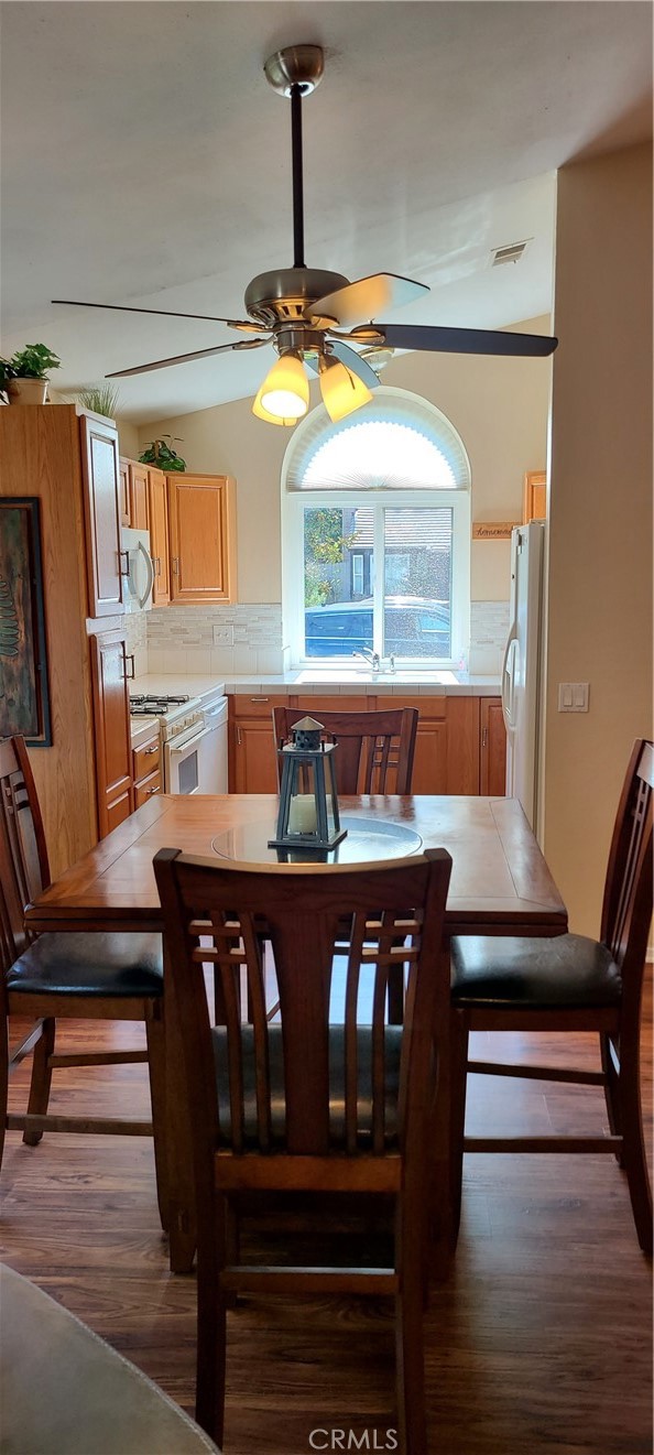 7153 Walcott Place Rancho Cucamonga, CA 91739 - Photo 6 of 35 a view of a dining room with furniture and wooden floor