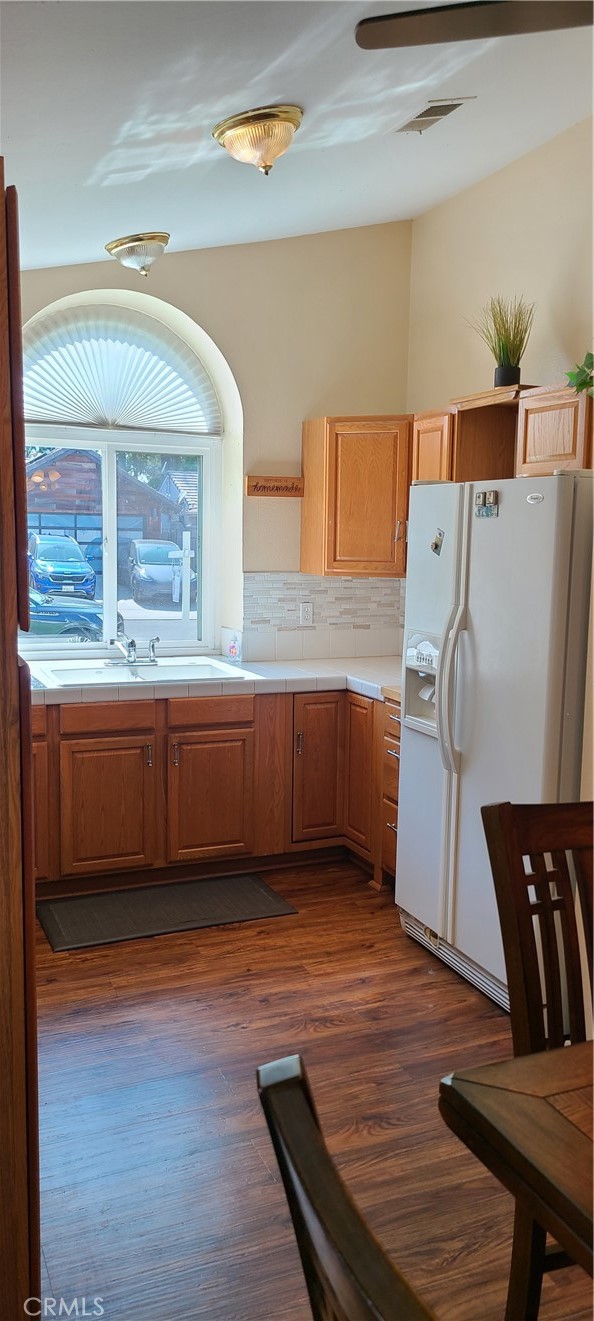 7153 Walcott Place Rancho Cucamonga, CA 91739 - Photo 8 of 35 a view of kitchen and wooden floor