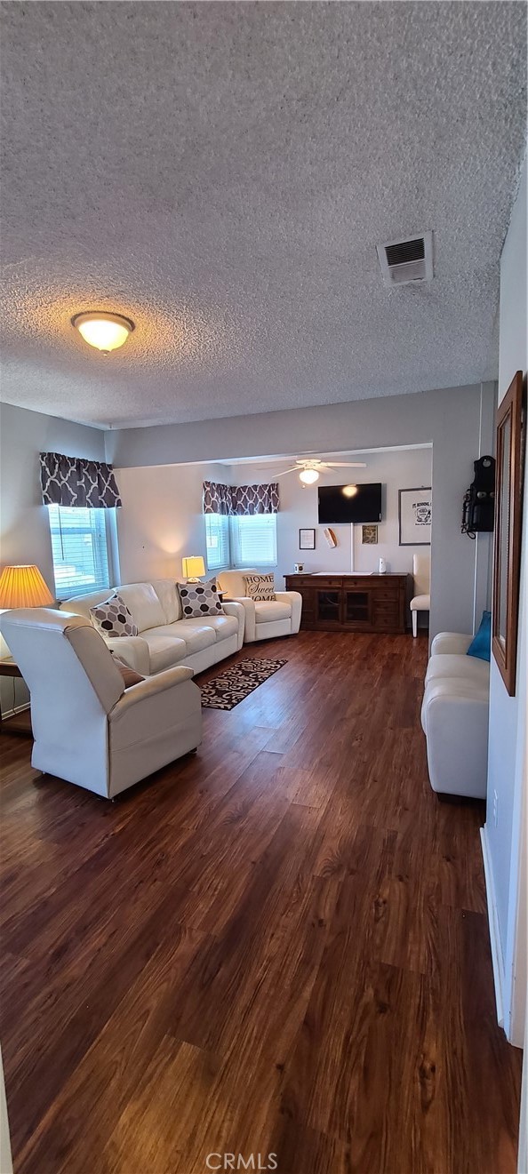 7153 Walcott Place Rancho Cucamonga, CA 91739 - Photo 10 of 35 a living room with furniture and a wooden floor