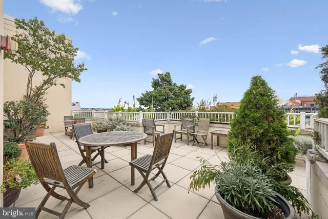 a view of a chairs and table in patio
