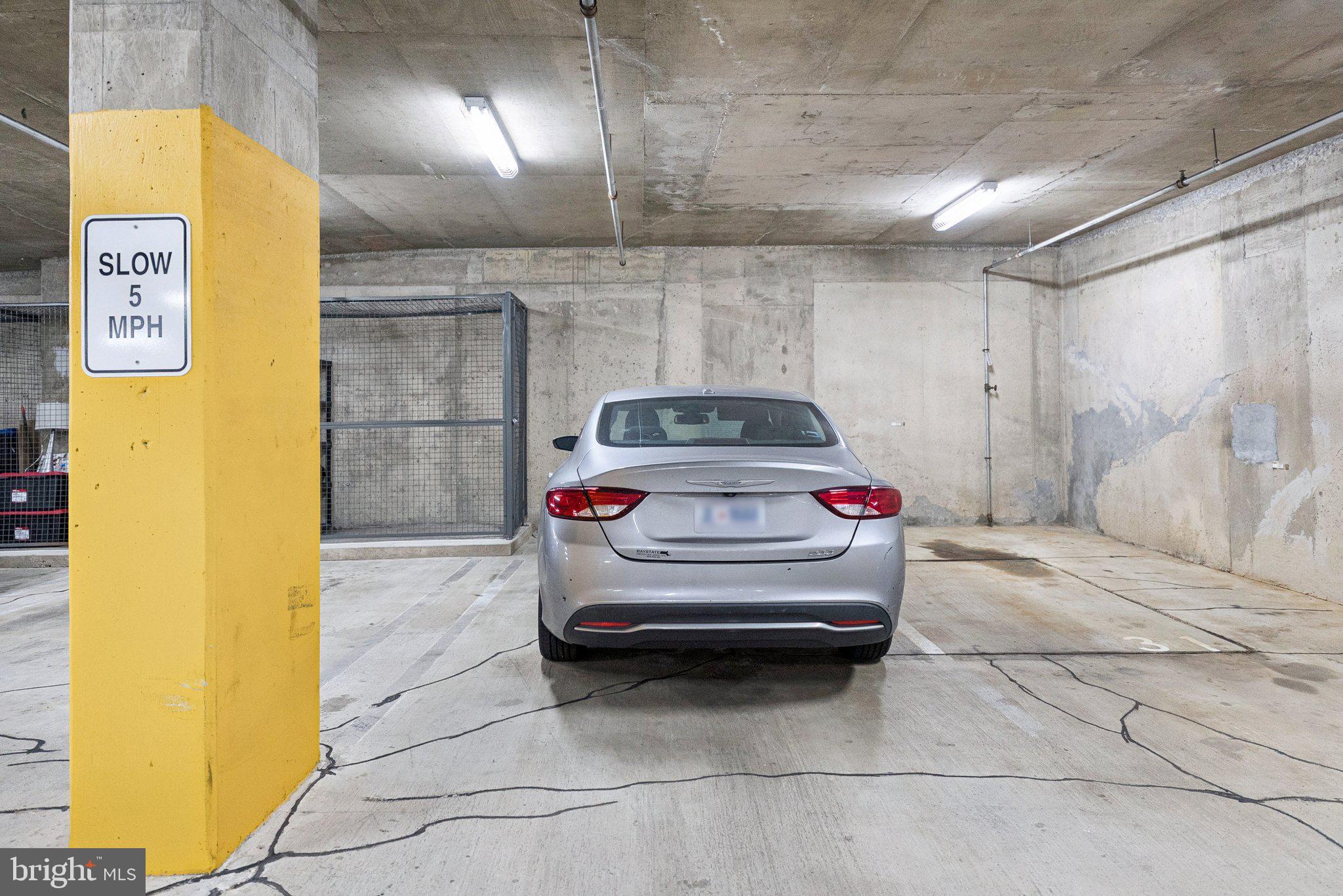 1111 11th Street Northwest, Unit 901 Washington, DC 20001 - Photo 21 of 24 a view of garage with a car parked