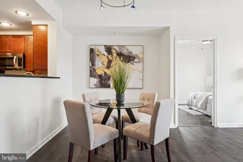 a view of a dining room with furniture and wooden floor