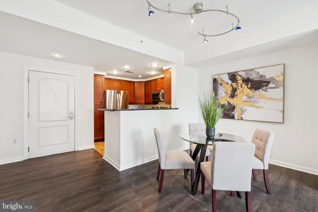 a view of a dining room with furniture and wooden floor