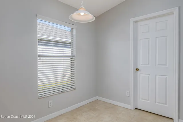 a view of a room that has a window in it