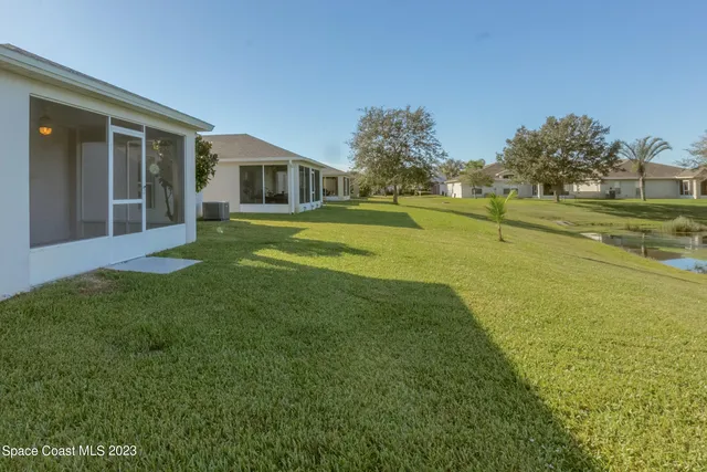 a view of a house with a big yard