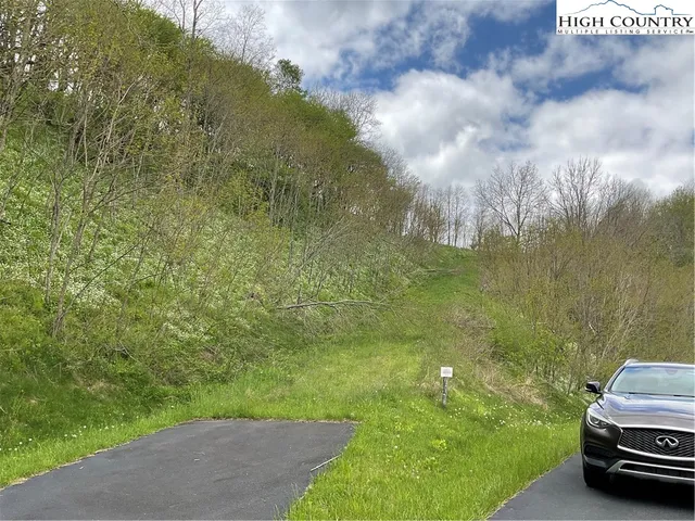 a car parked in the middle of a field