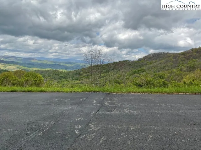a view of a yard with an ocean