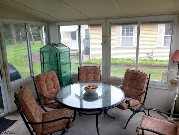 a view of a livingroom with furniture and a table