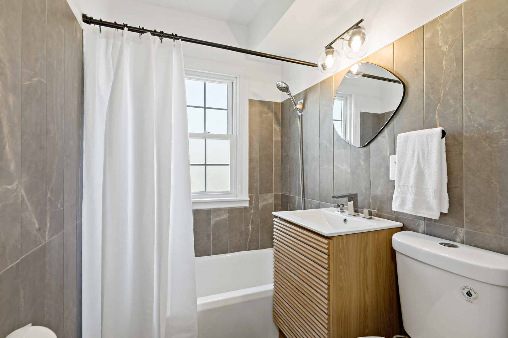 3634 177th Street Lansing, IL 60438 - Photo 14 of 15 a bathroom with a sink and a mirror