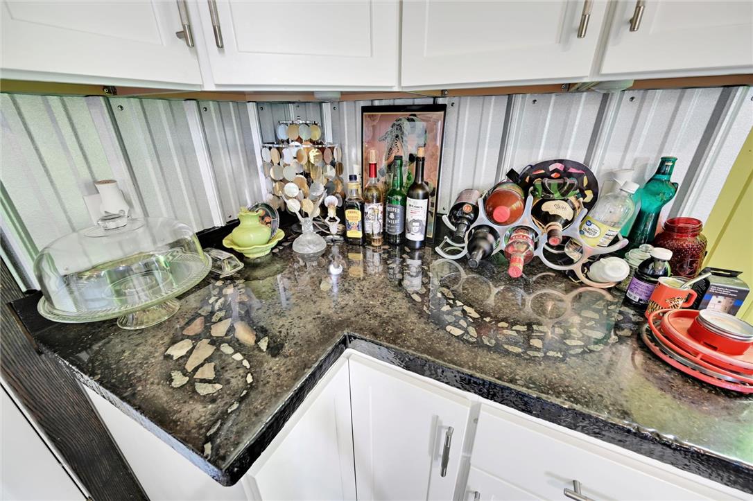 101 Conrad Road Fleetwood, PA 19522 - Photo 9 of 42 Custom countertops with unique stone inlays enhance this well-appointed kitchen corner.