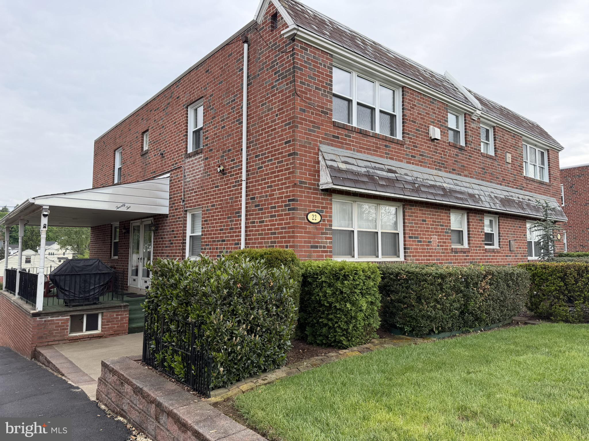 22 Windsor Road, Unit 2 Glenside, PA 19038 - Photo 1 of 29 Charming brick duplex with lush greenery.