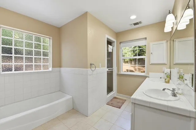 a bathroom with a sink and a bathtub