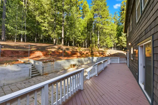 a view of a balcony with wooden floor