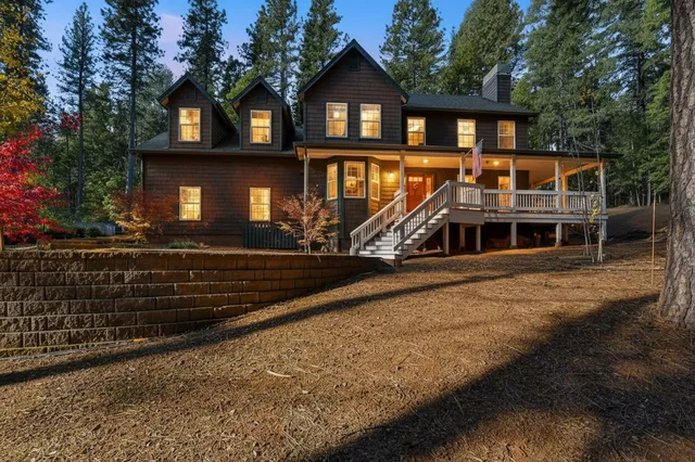 a front view of a house with yard