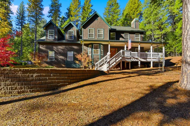 a front view of a house with wooden stairs